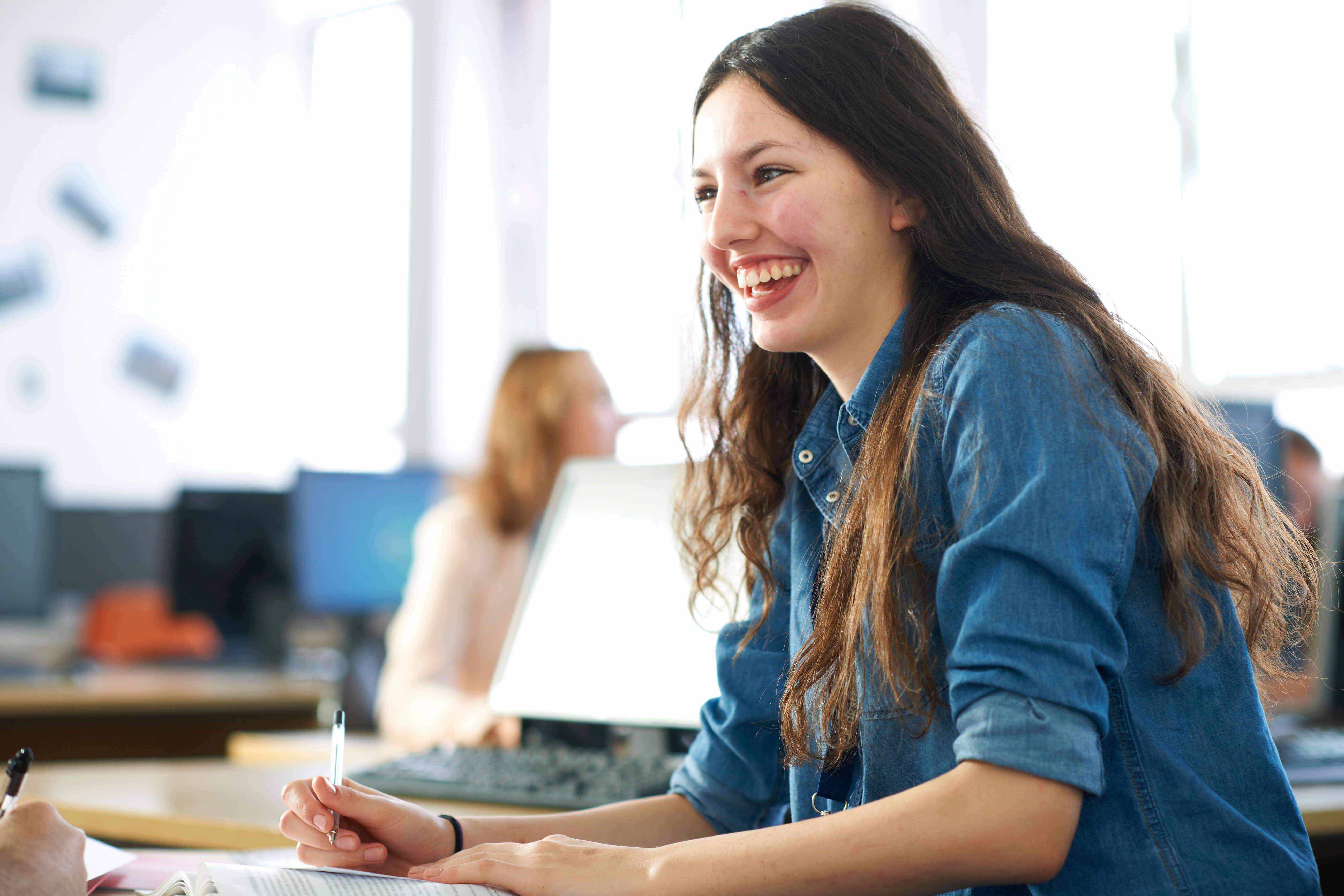 Young smiling woman in classroom