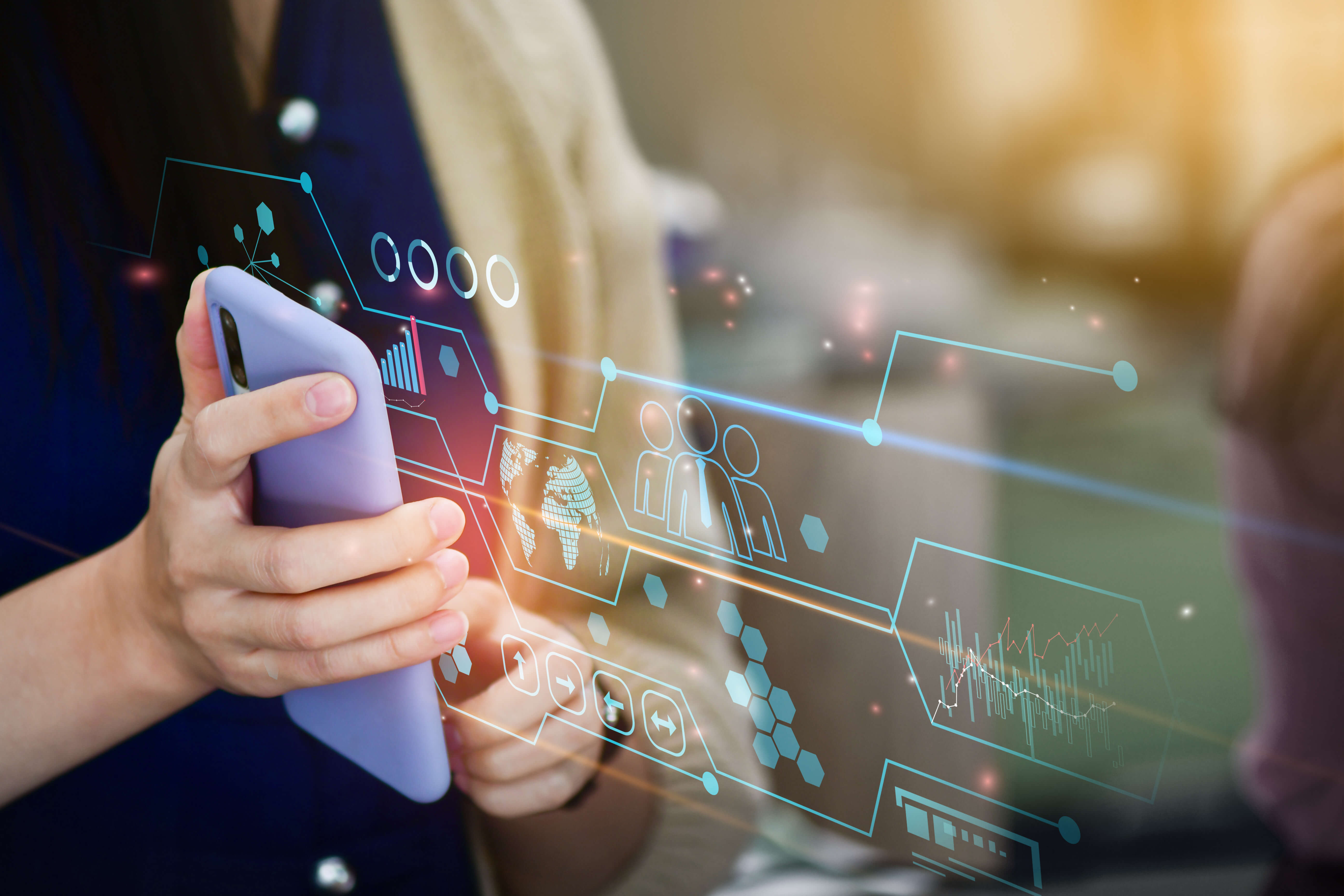 Woman holding a phone with data graphic hologram overlay