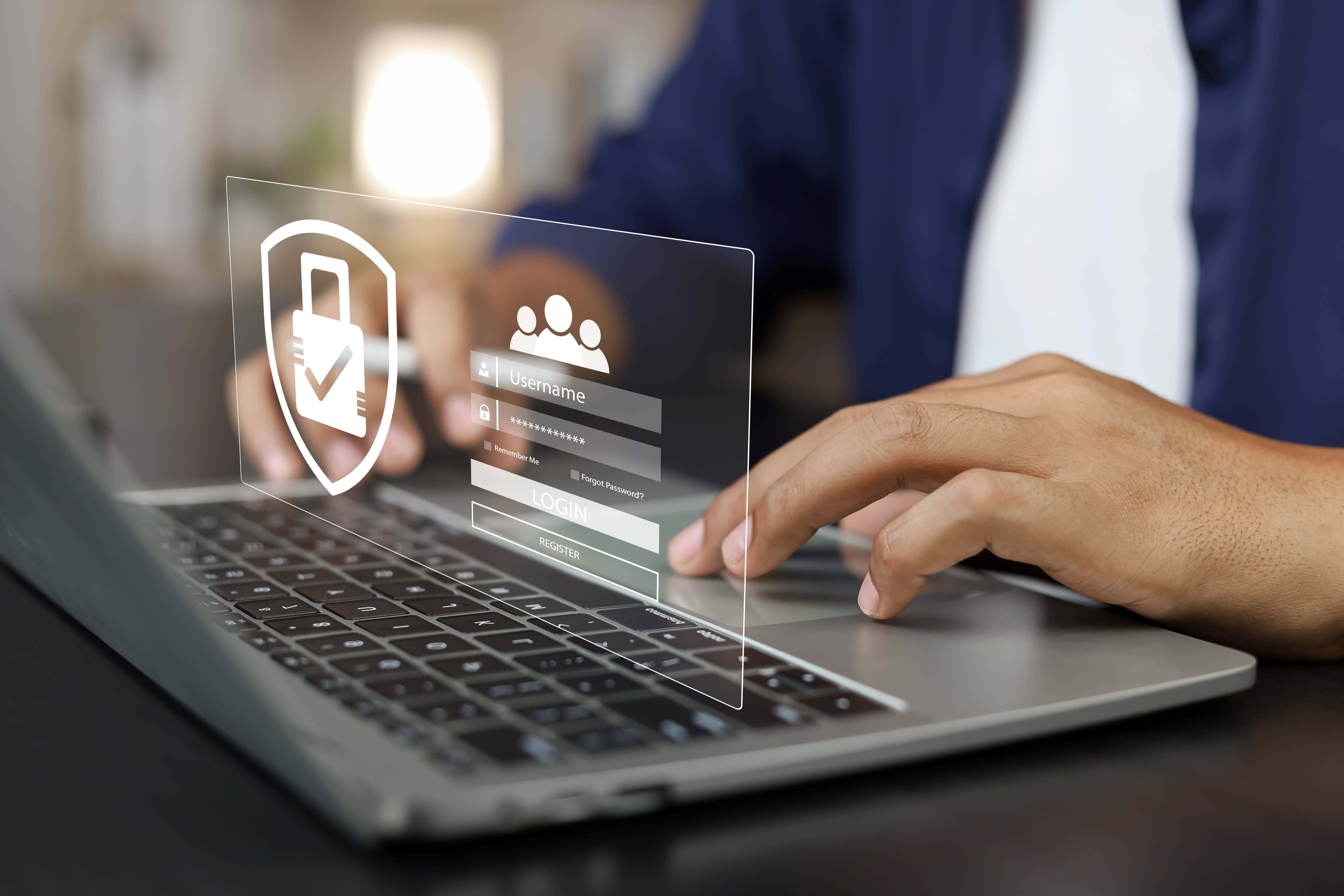 Close up of hands working on computer with data security