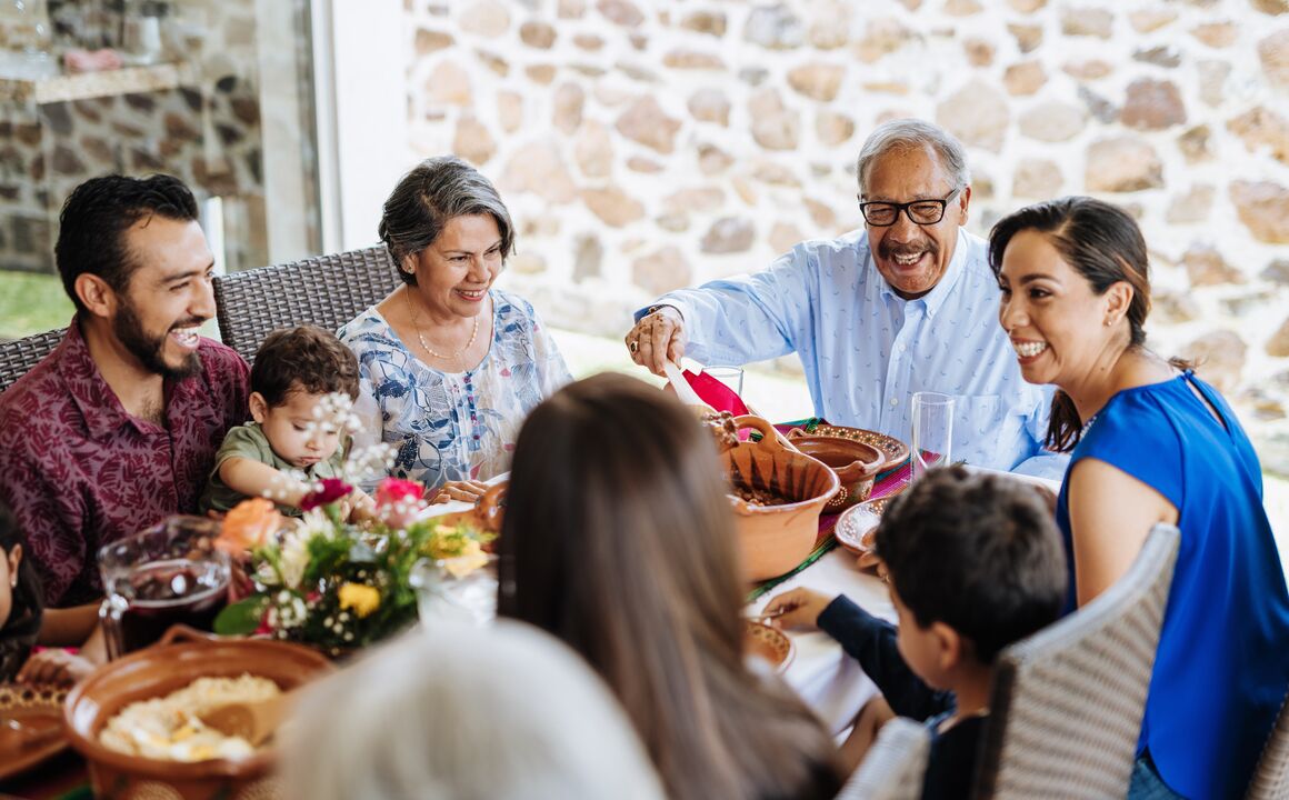 A family sitting around the dinner table.