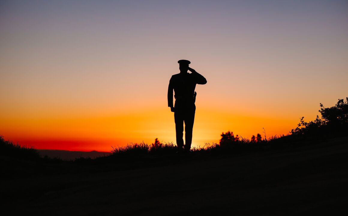 Sunset with a miliary Veterans saluting