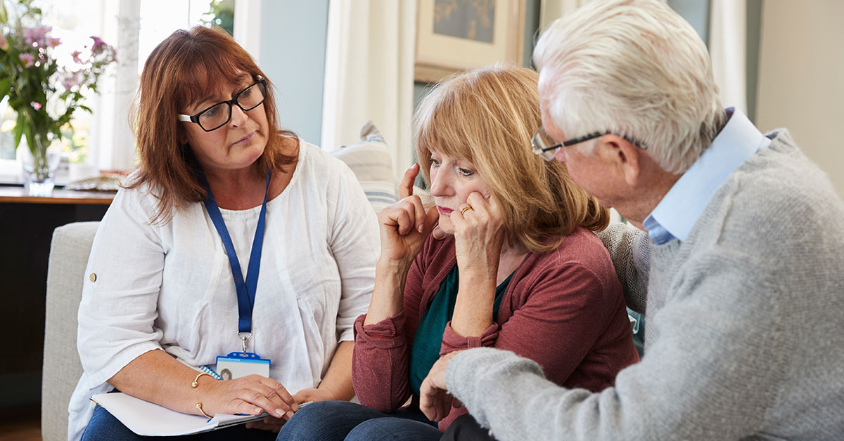 Clinical assessment professional listens to a concerned woman.