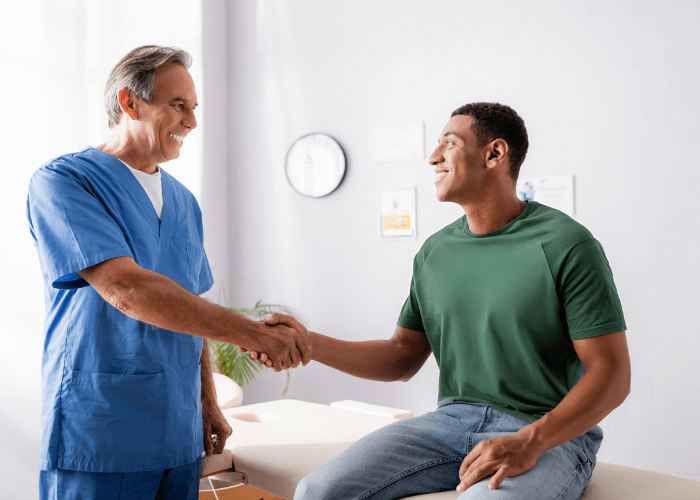 Physician talking with patient